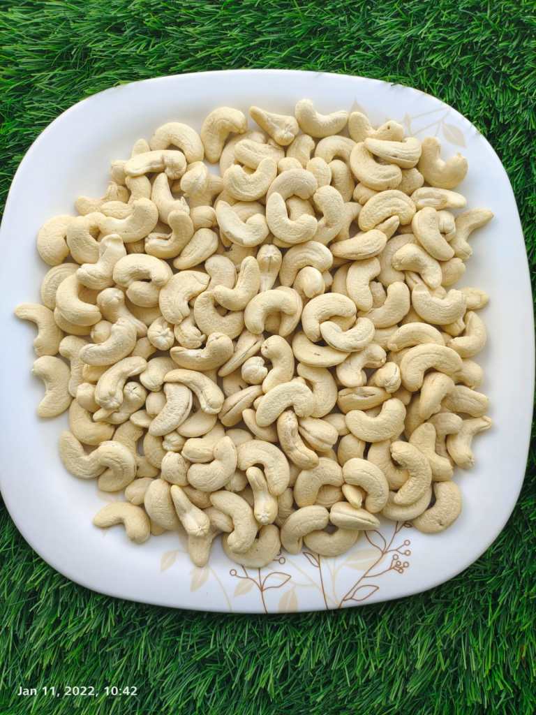 Walnuts kernels on dark desk colour background